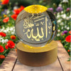 Elegant 3D crystal ball Arabic night lamp with Islamic calligraphy on wooden base outdoors