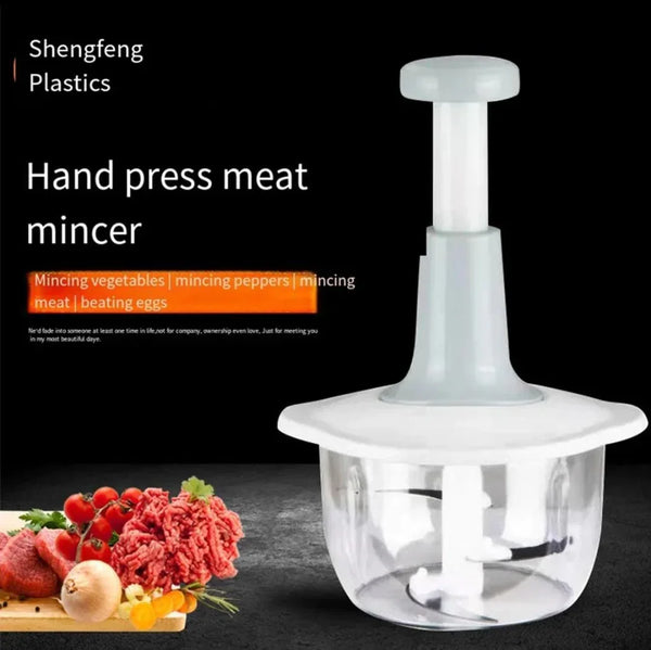 Manual hand push chopper for vegetables and meat, with transparent bowl and food display.