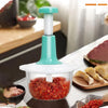 Manual hand push chopper with chopped red vegetables in a modern kitchen setting
