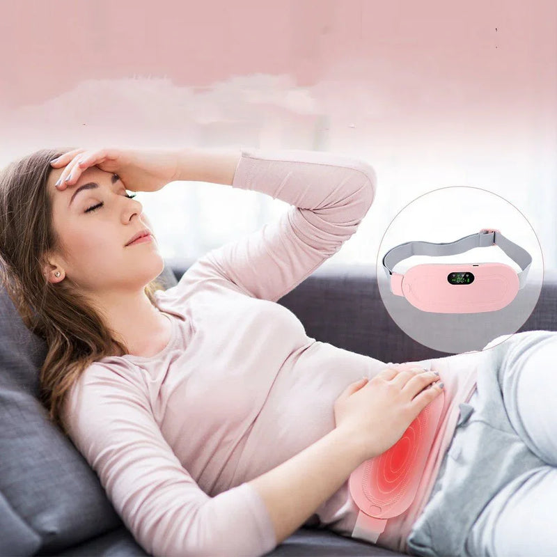 Woman using menstrual pain relief heating waist belt while lying on sofa